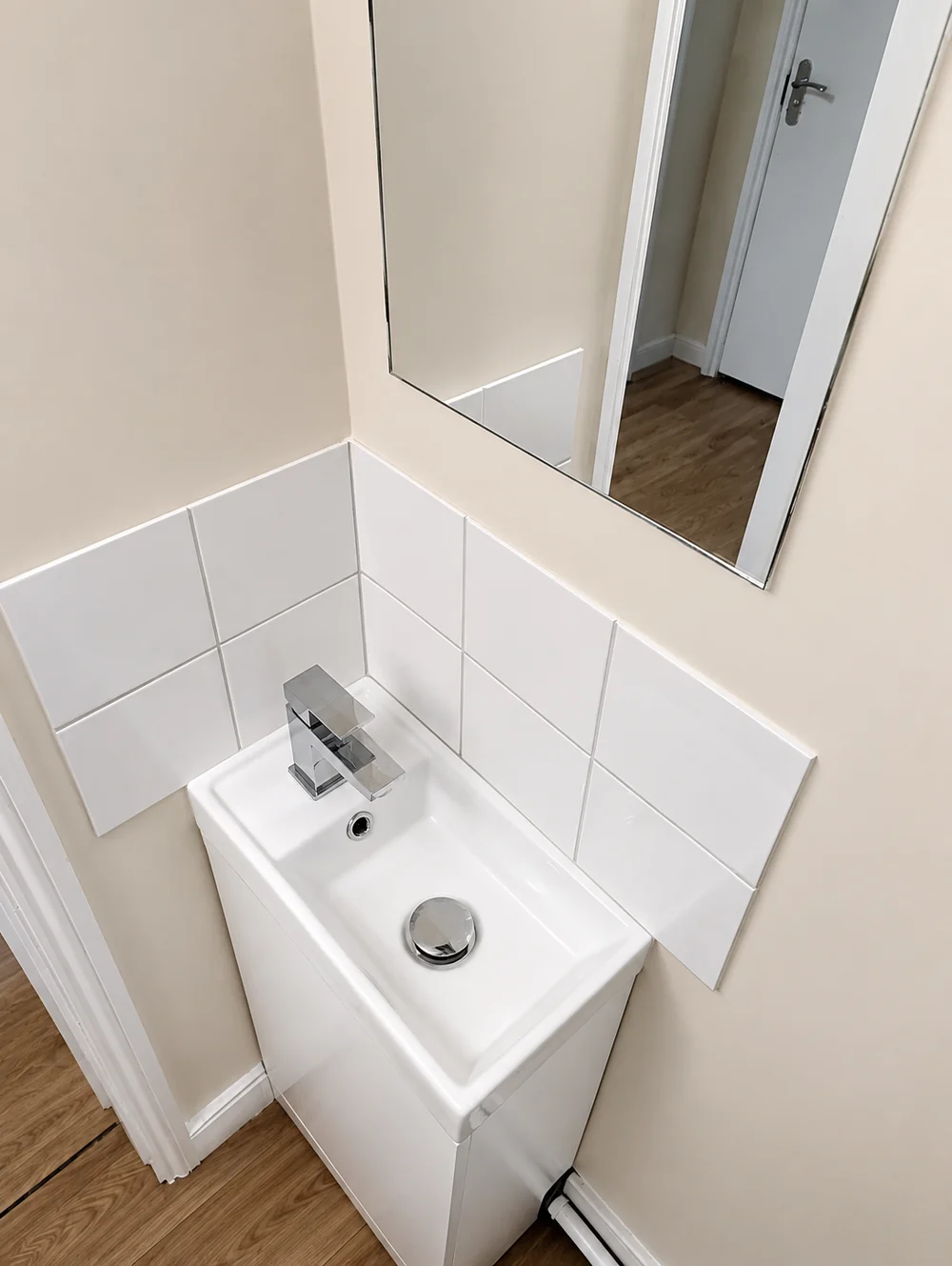 Guest washbasin and mirror at Cedars House
